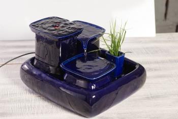 a blue ceramic fountain from miaustore