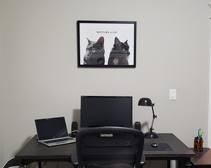 rearranged office with the portrait on the wall